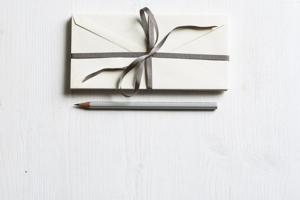 decorative image: envelopes and pencil