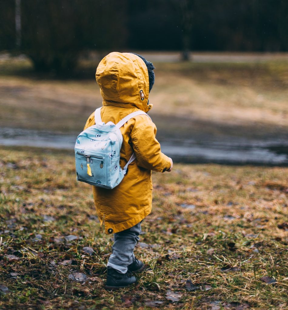 toddler in jacket with back turned
